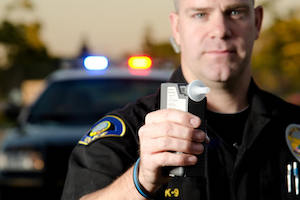 Police office holds breathalyzer